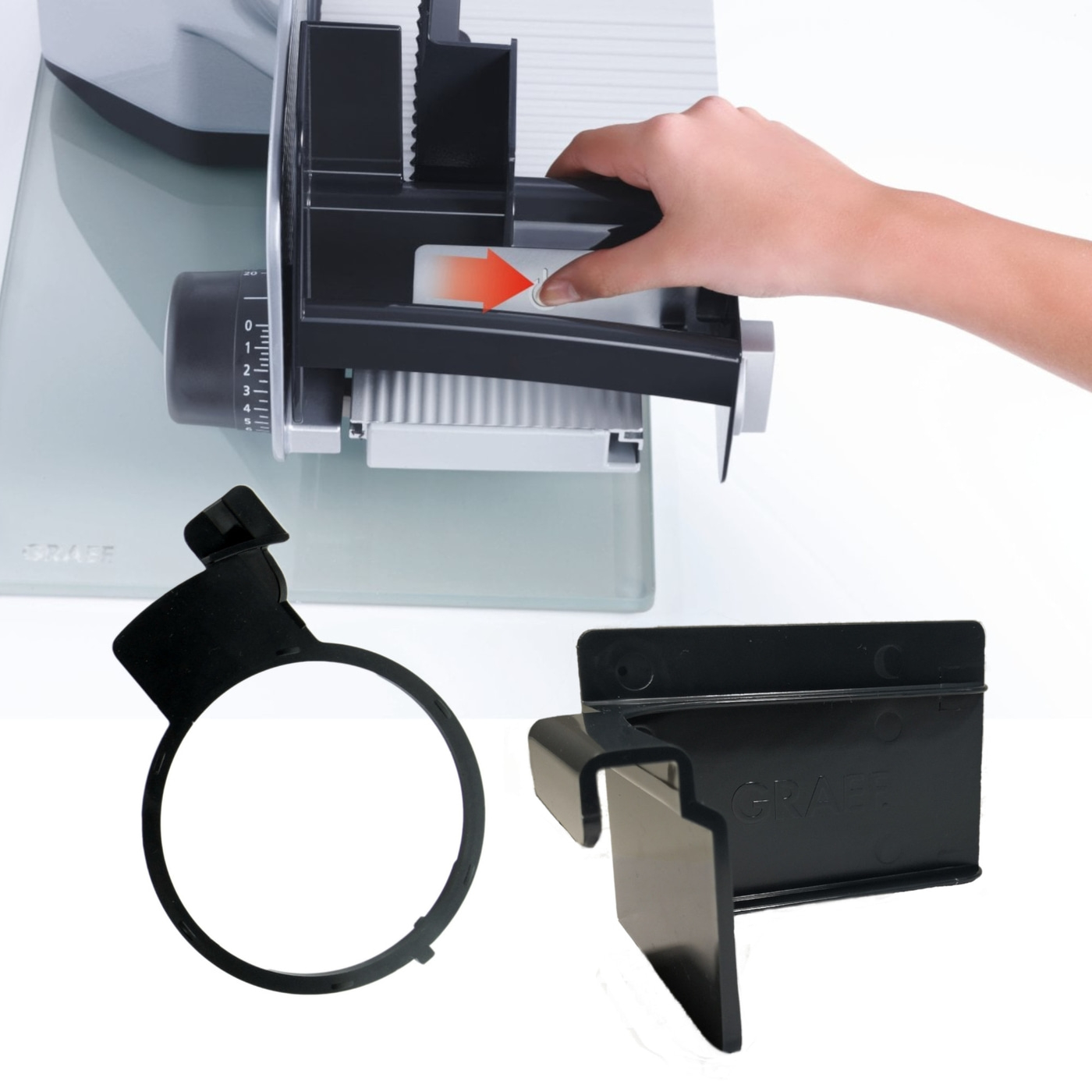 Meat slicer with accessories, hand operated, arrow indicates direction