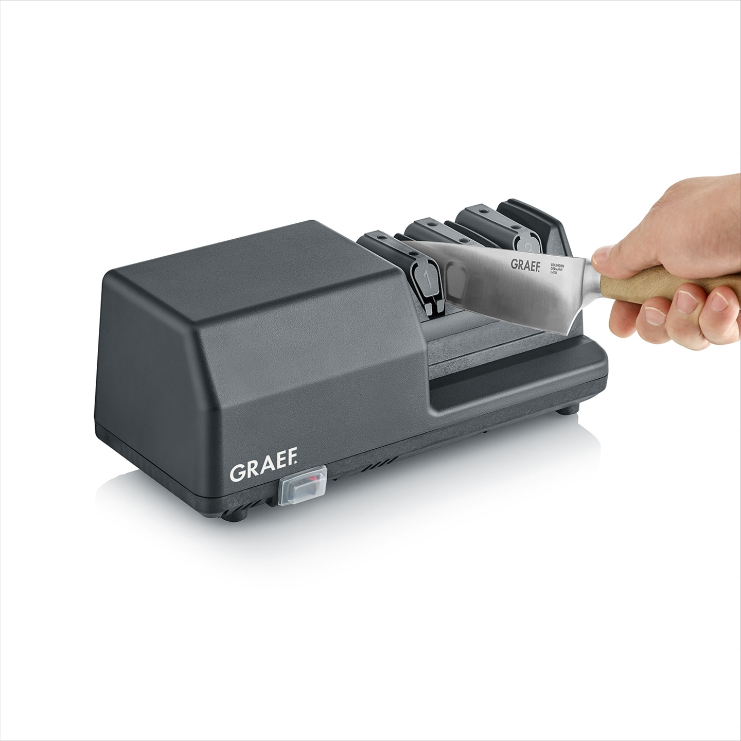 Graef knife sharpener with knife in use, ready to sharpen the blade.