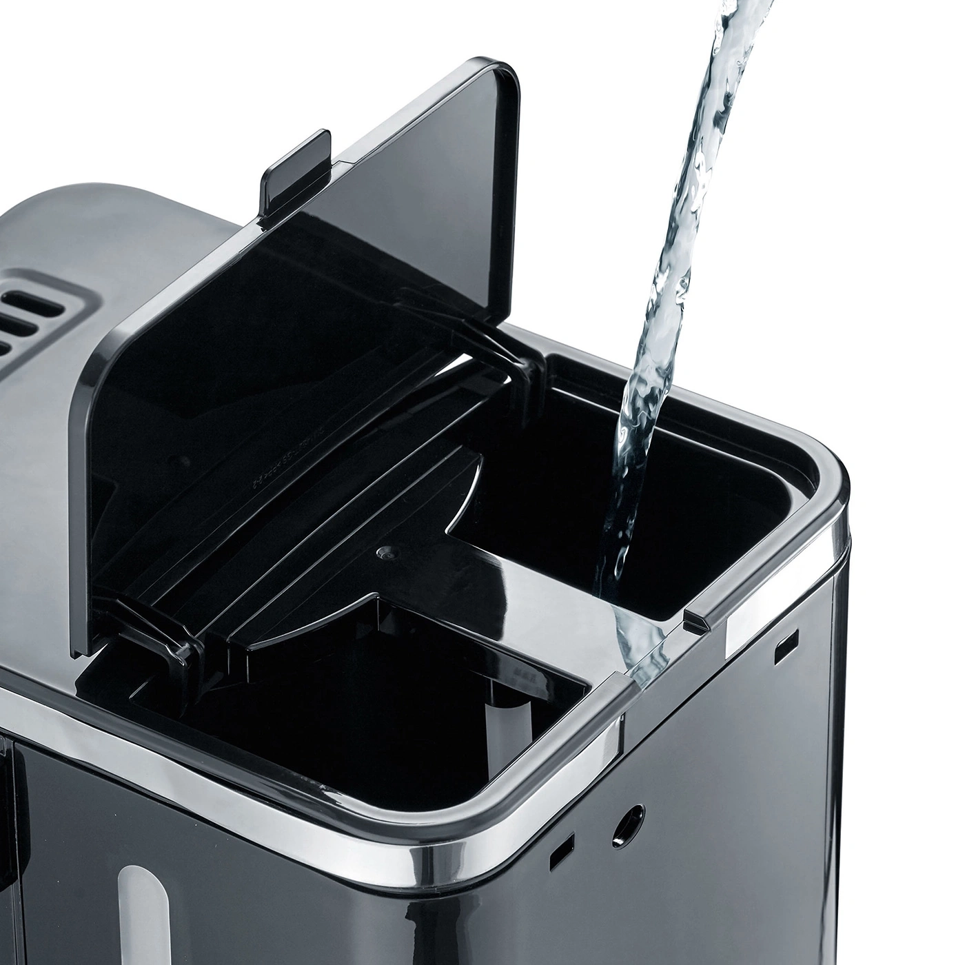 Coffee machine being filled with water, black appliance, open lid, close-up shot