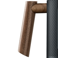 Wooden handle and black texture. Close-up of an object. Design and detail.