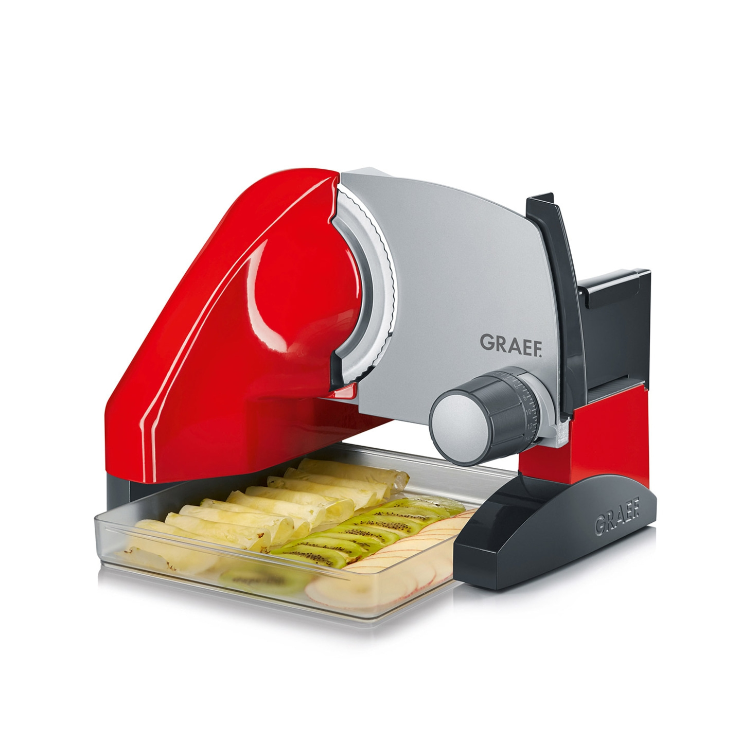 Red Graef food slicer with sliced fruits and vegetables in the tray, ready to serve