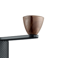 Wooden handle on black metal. Coffee grinder detail shot. Close-up.