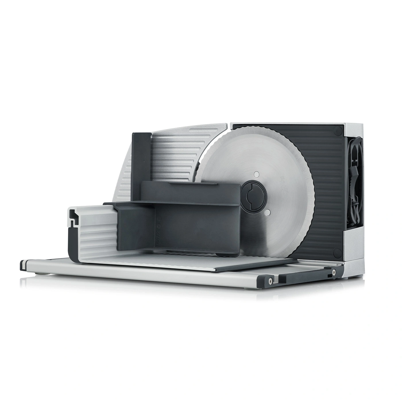 Electric food slicer with large circular blade and black and silver body