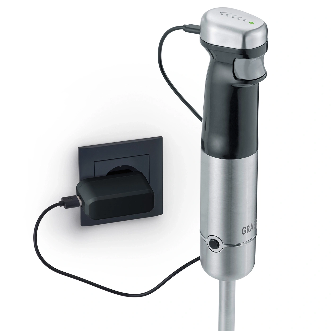 Hand blender with charger plugged into a wall outlet for charging.