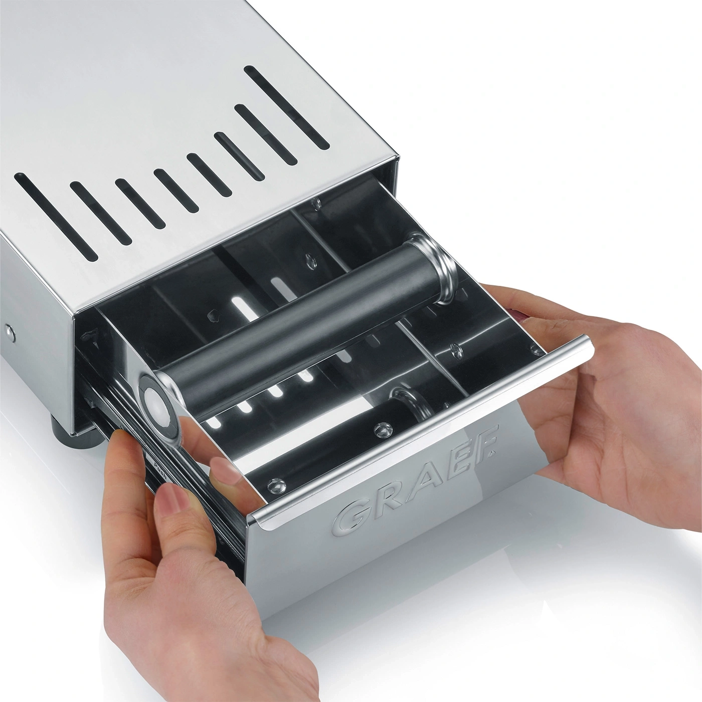 Stainless steel device with drawer, hands pulling drawer out, GRAEF logo visible.