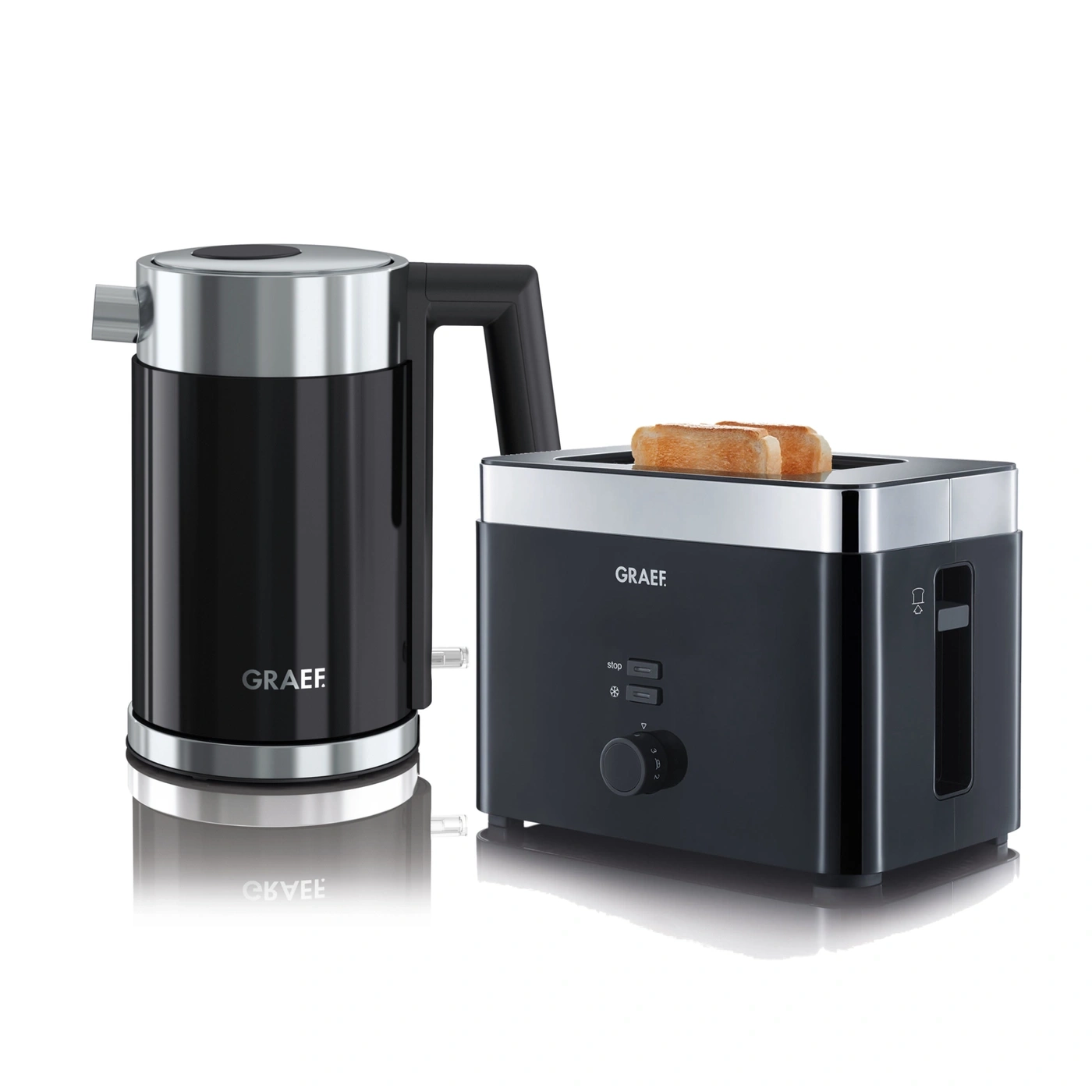 Black kettle and toaster with toast, kitchen appliances, studio shot, isolated on white