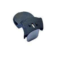 Black plastic part with holes and a curved shape on a white background