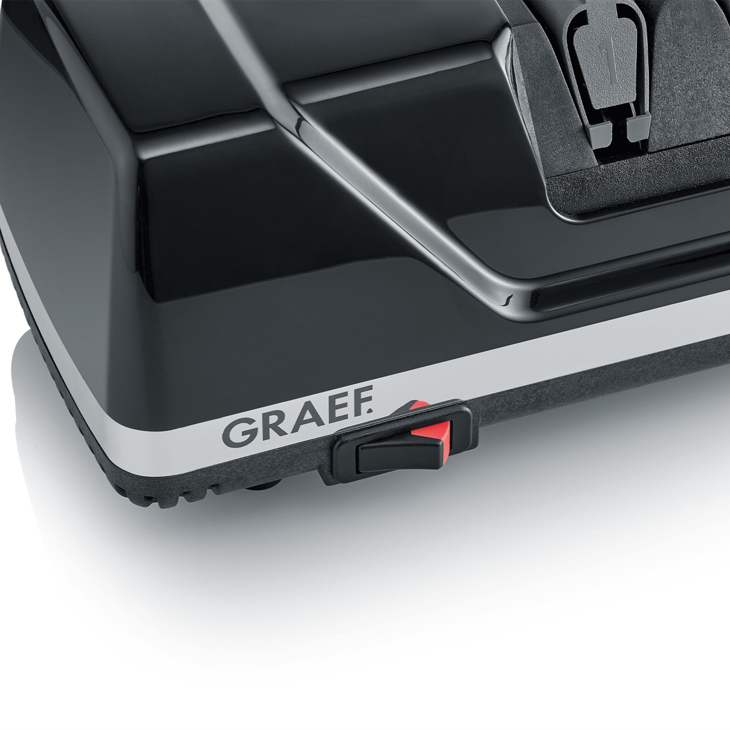 Schwarzes Gerät mit rotem Schalter und GRAEF-Logo auf weißem Hintergrund.