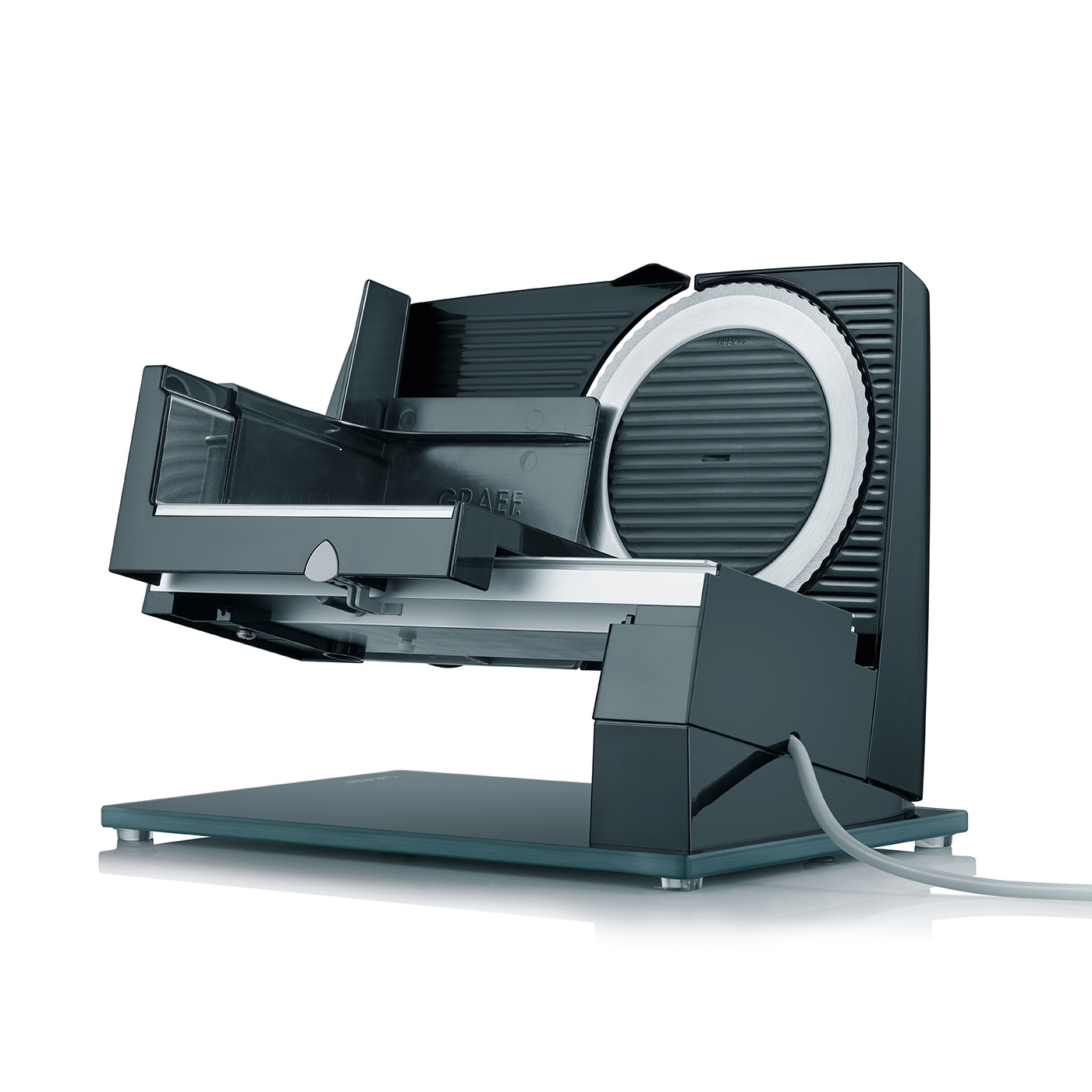 Black electric Graef slicer with blade and cable, ready to slice food.