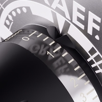 Close-up of a black dial with white markings and numbers, showing detail.