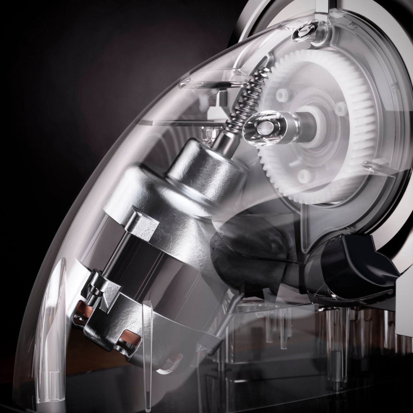 Close-up of a transparent device with gears and a motor, detailed view