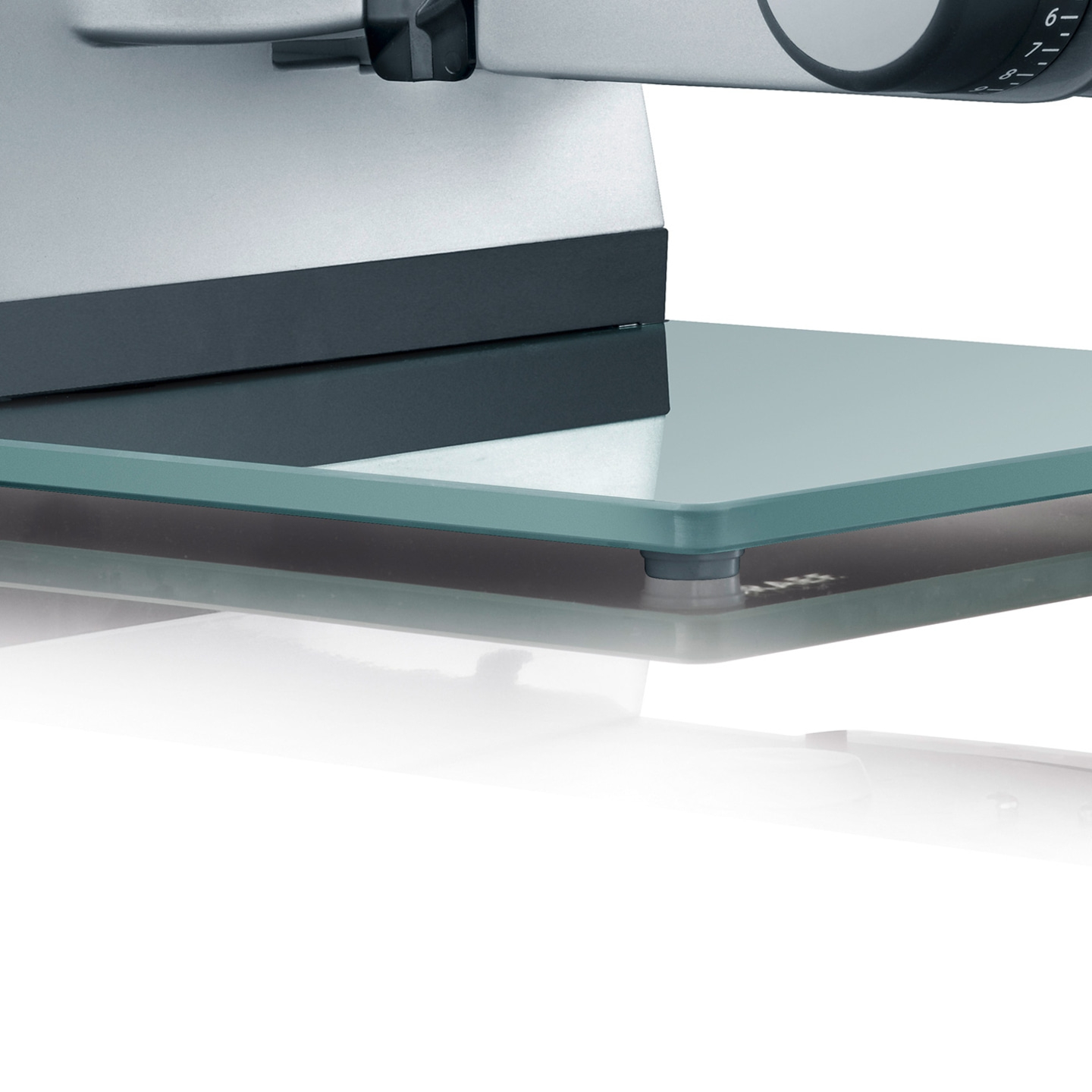 Close-up of a glass cutting board rest on a sled