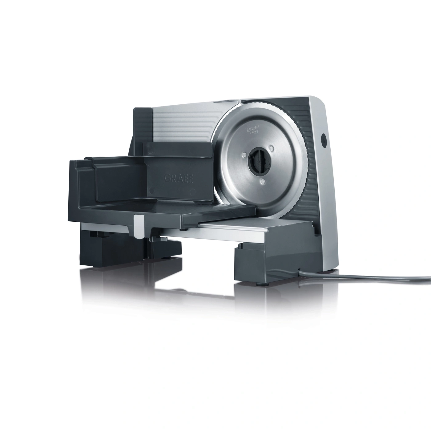 Grey electric food slicer with a reflective surface and a white background