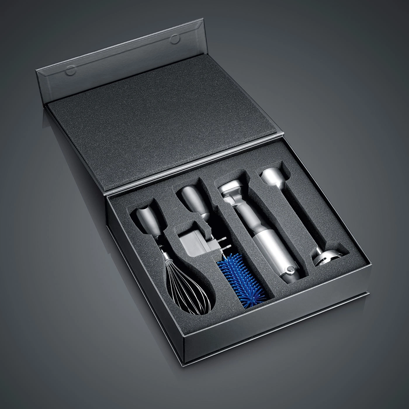 Black box with kitchen tools embedded in foam, a set for cooking.
