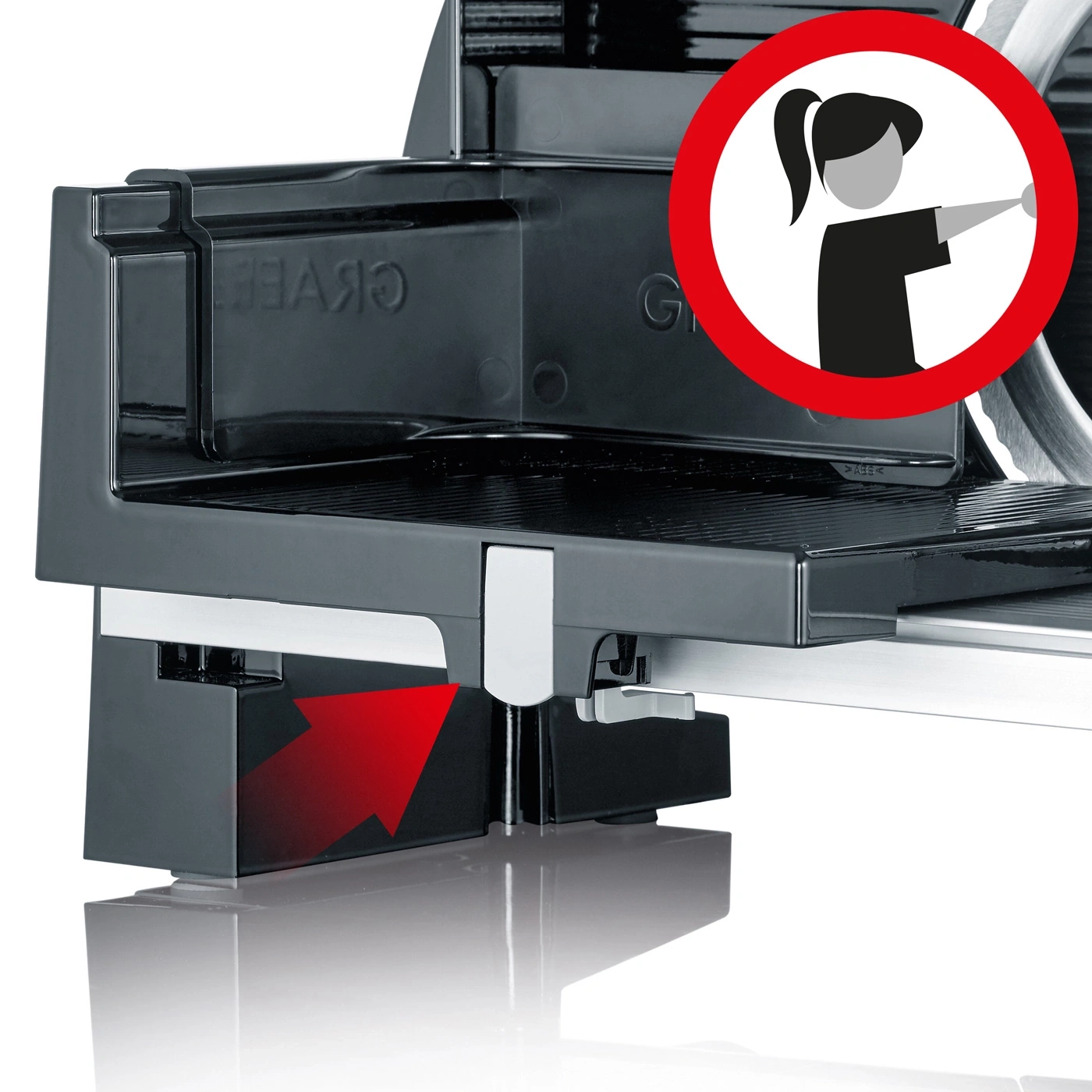 Meat slicer with red arrow and warning sign for safety instructions