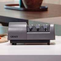 Graef Messerschärfer, grau, mit den Nummern 1, 2 und 3, auf weißem Tisch