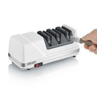 A white electric knife sharpener by Graef with a knife in slot 3.
