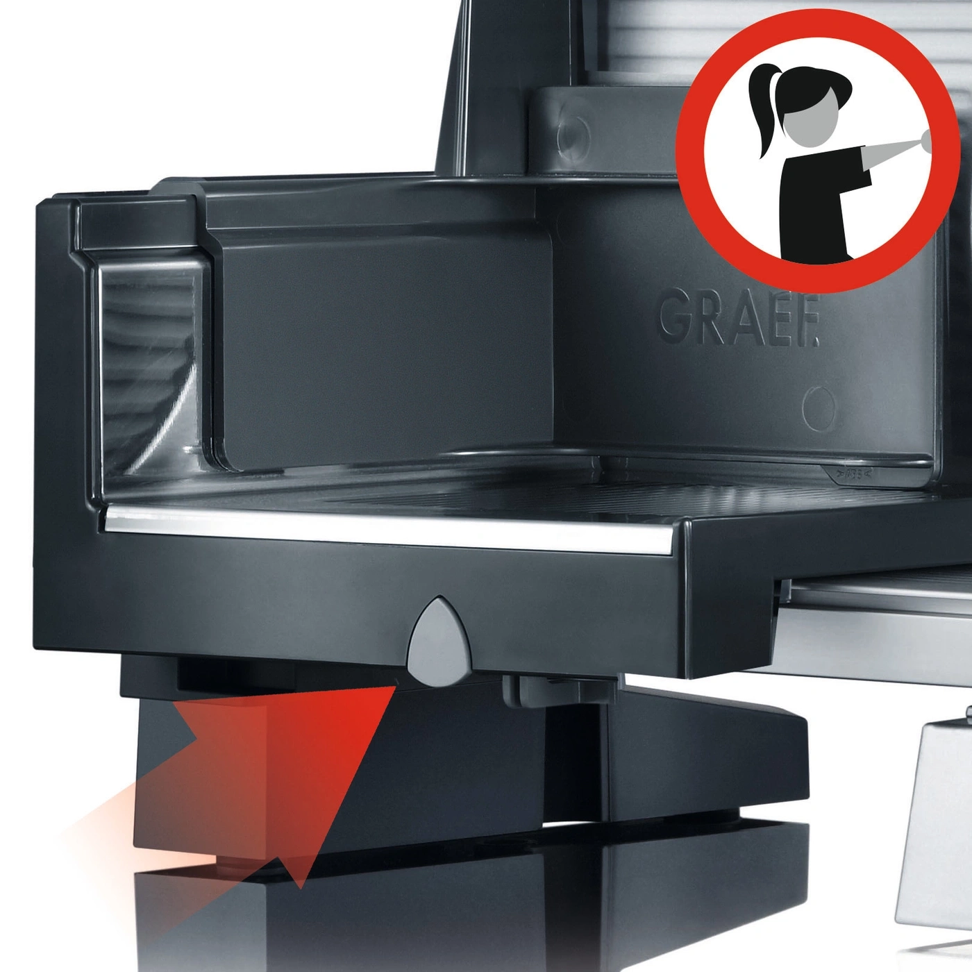 Graef slicer with red arrow and safety warning symbol for safe operation.