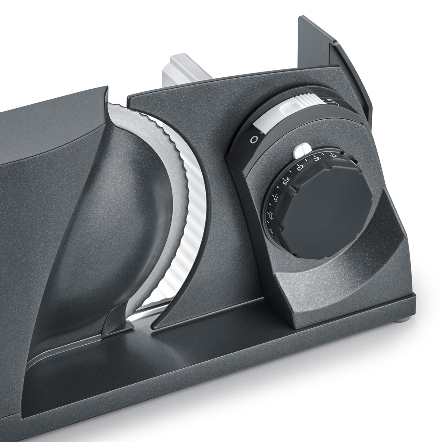 Gray electric food slicer with adjustment dial and blade for slicing food products.