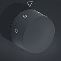 Drehknopf mit Zahlen 5 und 6, dunkler Hintergrund, Dreieck-Markierung, grau