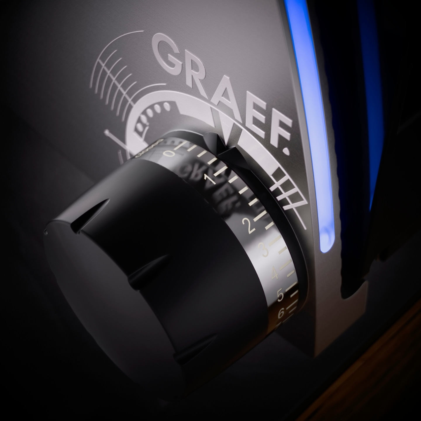Close-up of a black dial with the GRAEF logo and blue illumination.