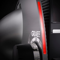 Graef coffee grinder, detail shot, red light, black background, numbers on dial