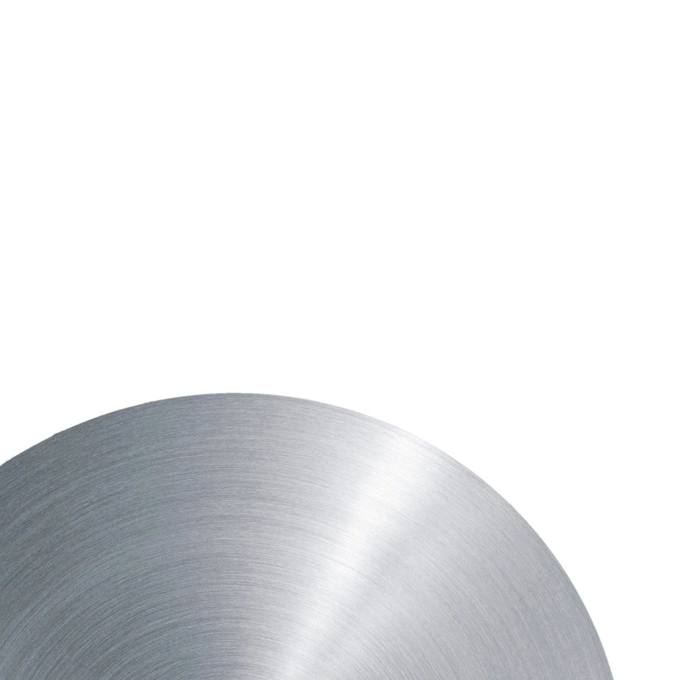 Circular metal surface with brushed texture against a bright white background