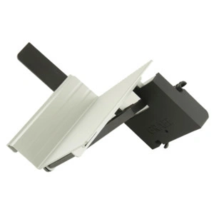 White and black metal part attached to another part, angled and complex.