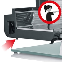 Meat slicer with red arrow and safety warning symbol for use