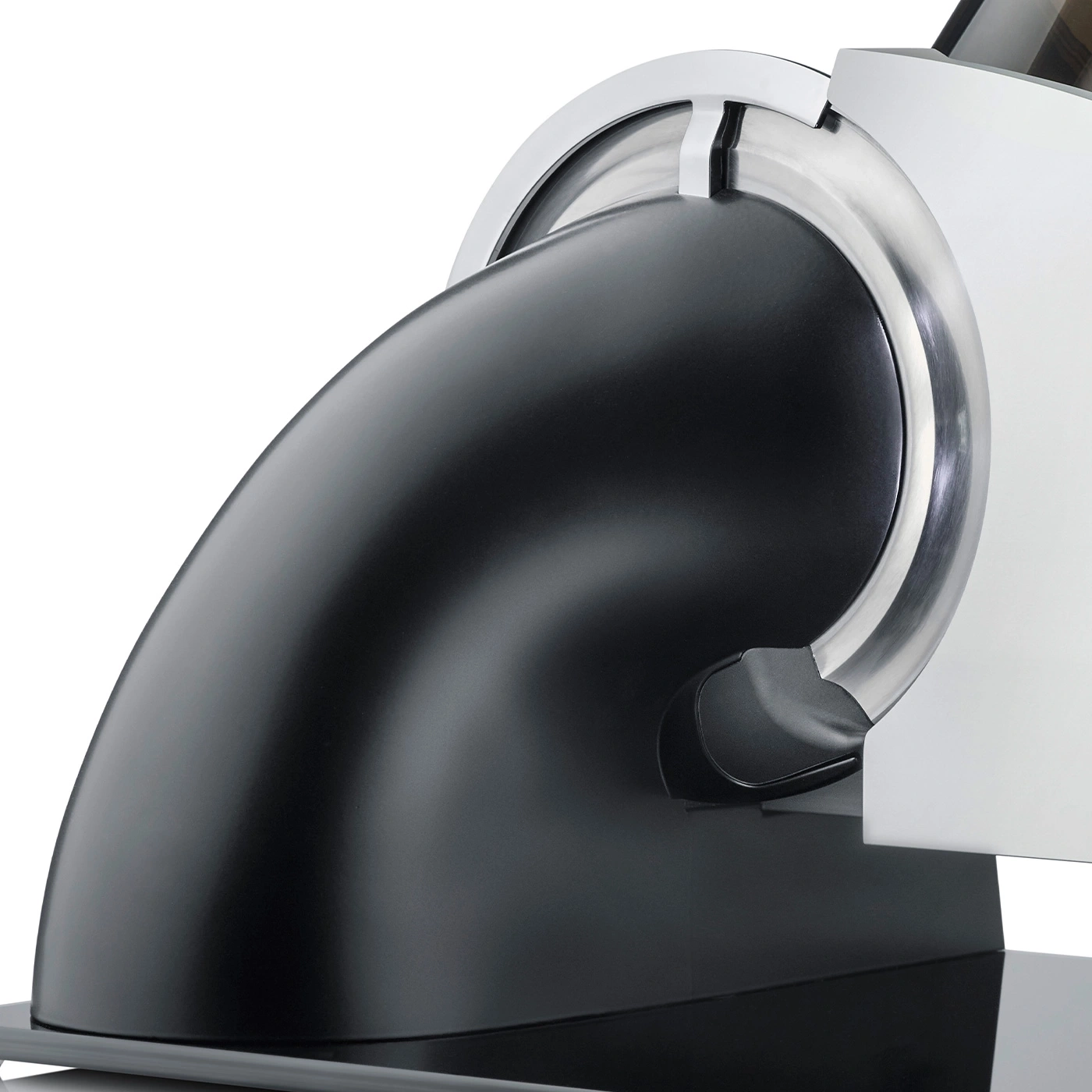 Close-up of a black kitchen appliance with silver accents against a white background.