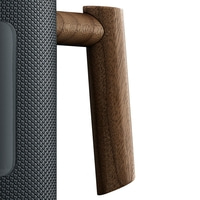 Speaker with wooden handle. Dark design, close-up, isolated on white.