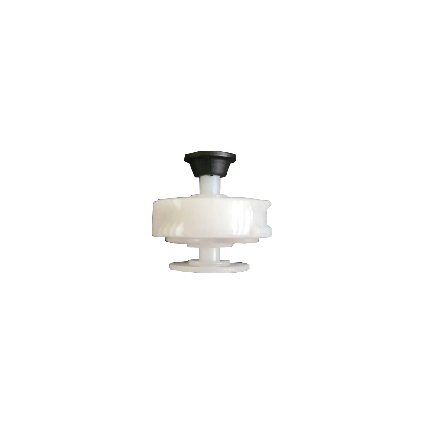 White plastic part with black button isolated on white background
