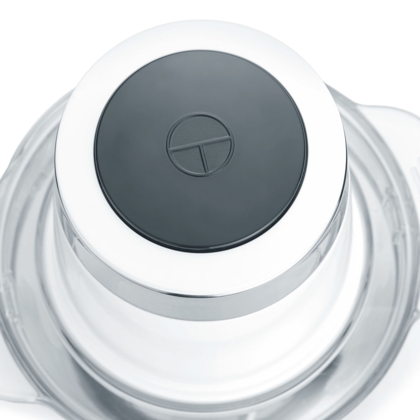 Close-up of a kitchen appliance with a dark button and a logo on top.
