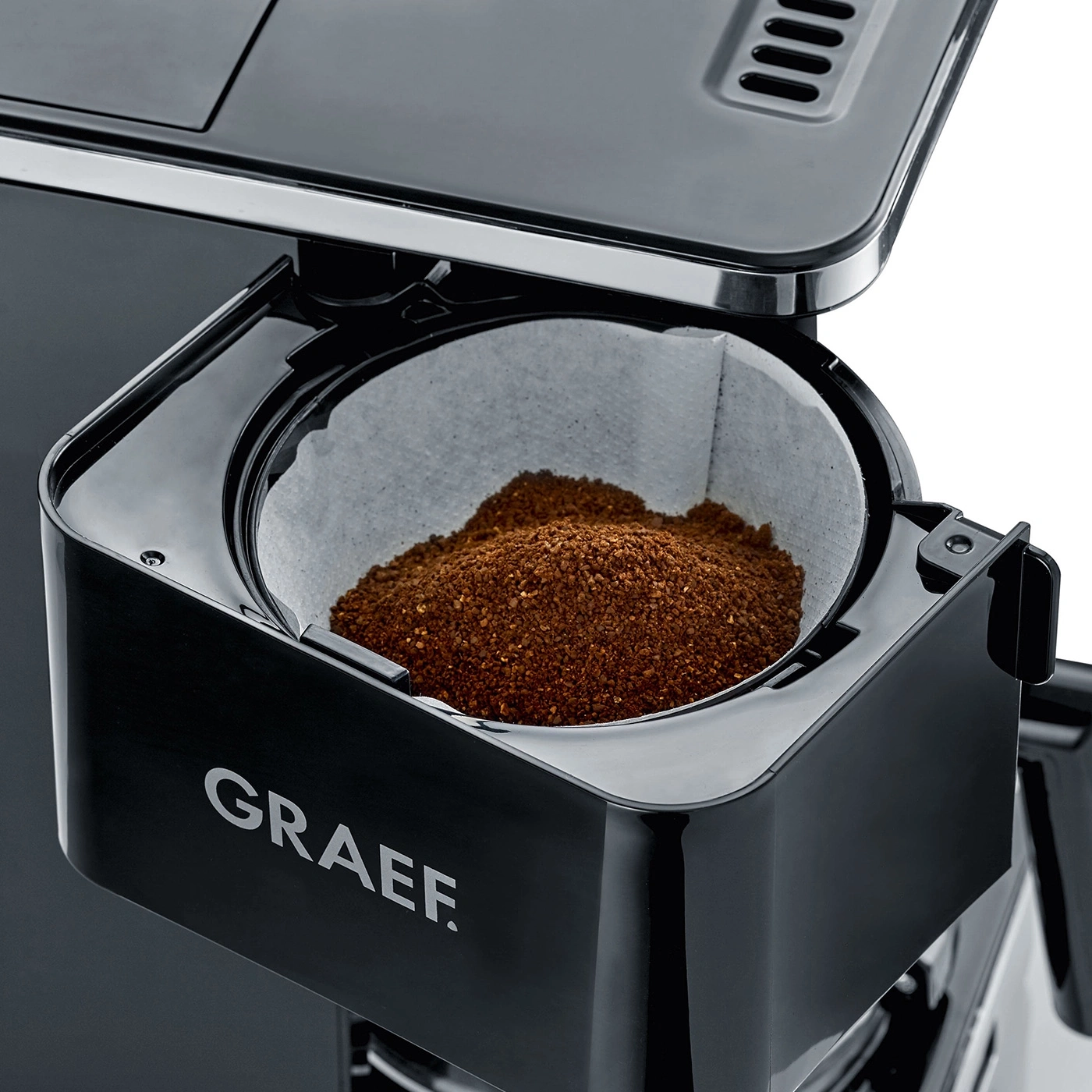 Coffee machine with coffee filter and coffee grounds, close-up, black, GRAEF logo