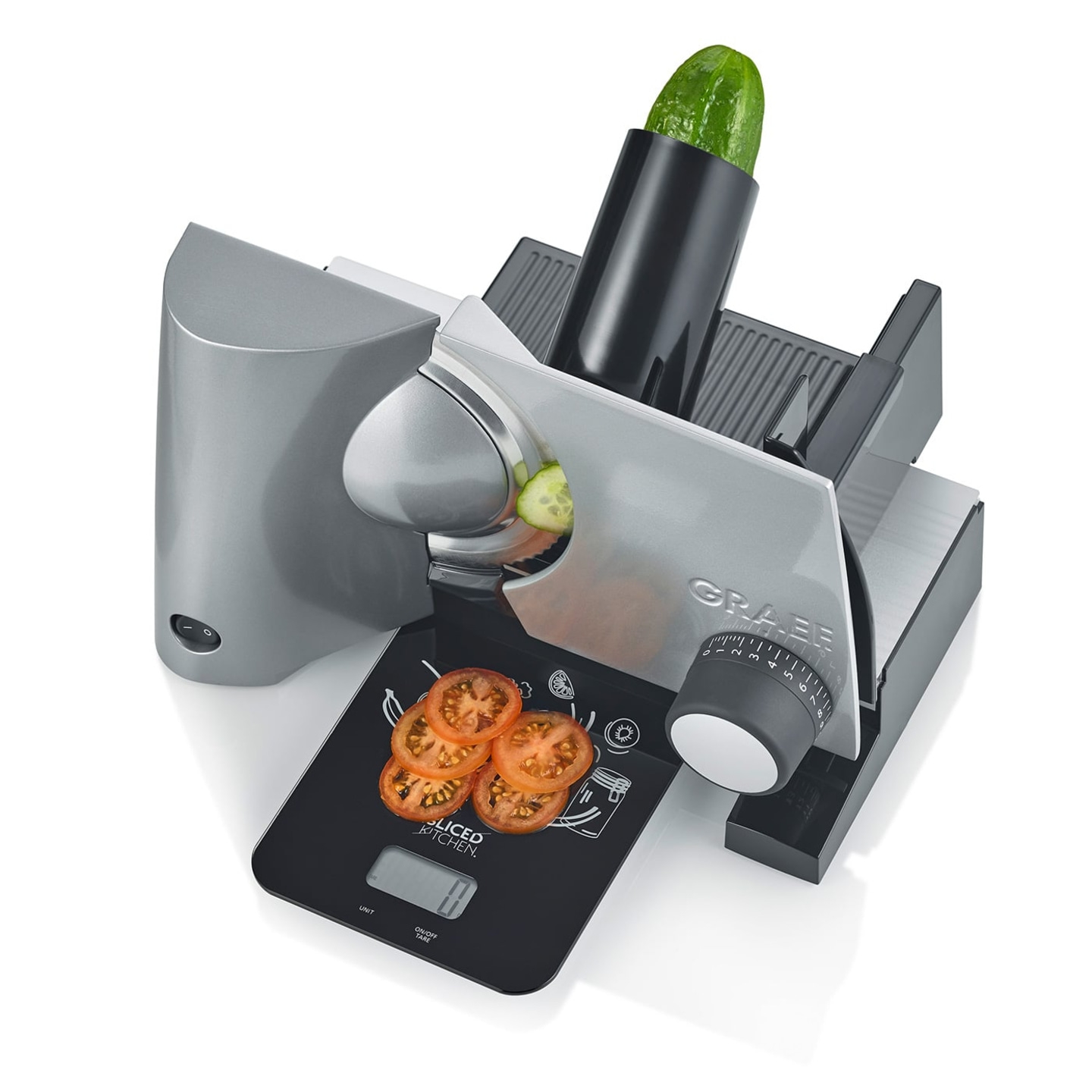 Gray kitchen machine with cucumber and tomatoes on a scale. Slicing machine.