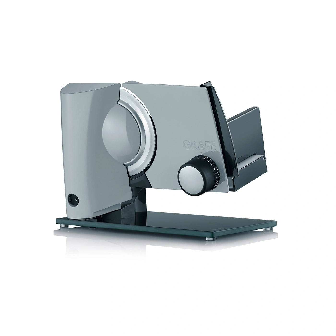 Gray Graef slicer with blade and dial on glass base, kitchen appliance, food prep