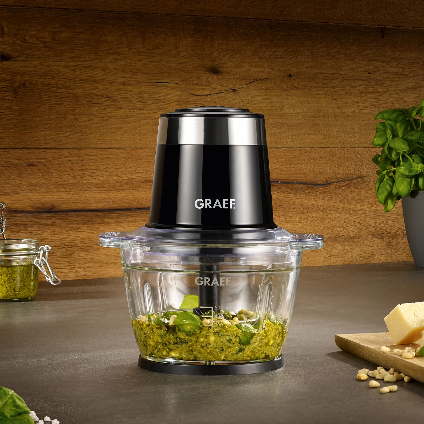 Graef food processor with pesto, parmesan, and pine nuts on a countertop