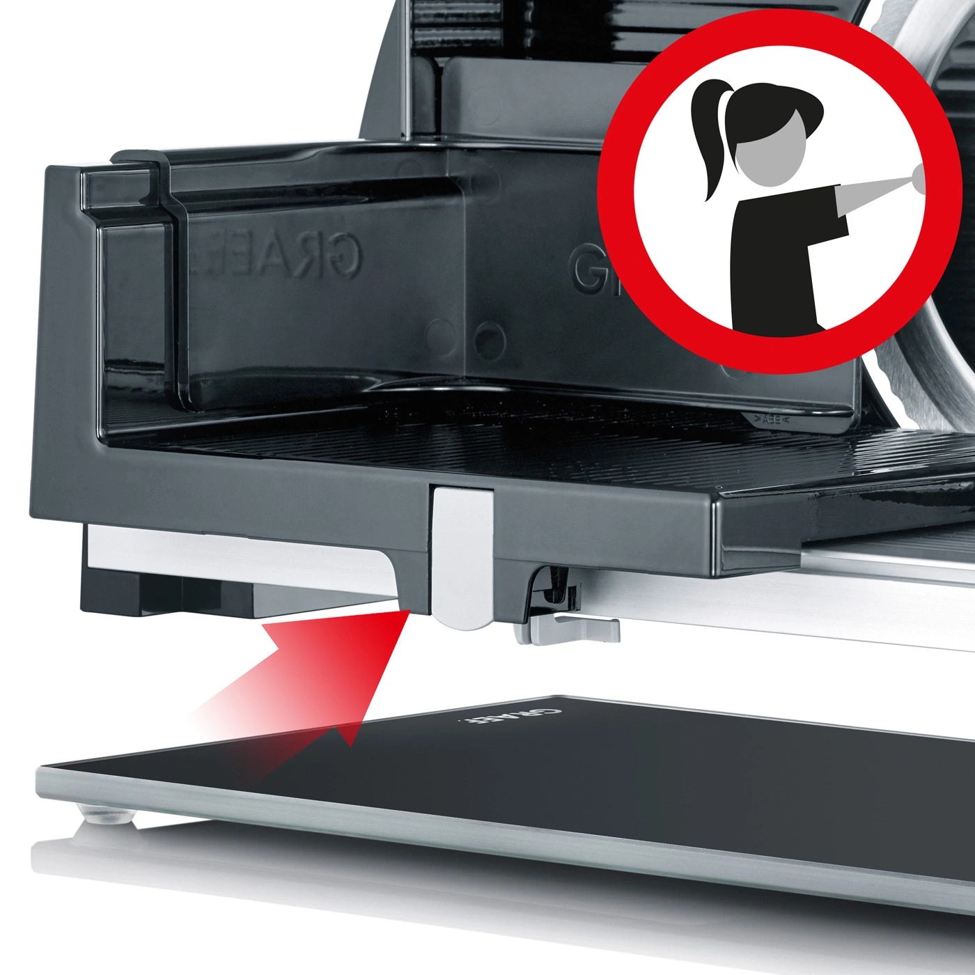 Meat slicer with red arrow and warning symbol for safety instructions