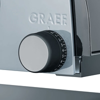 A close-up of a Graef slicer with a dial and scale.
