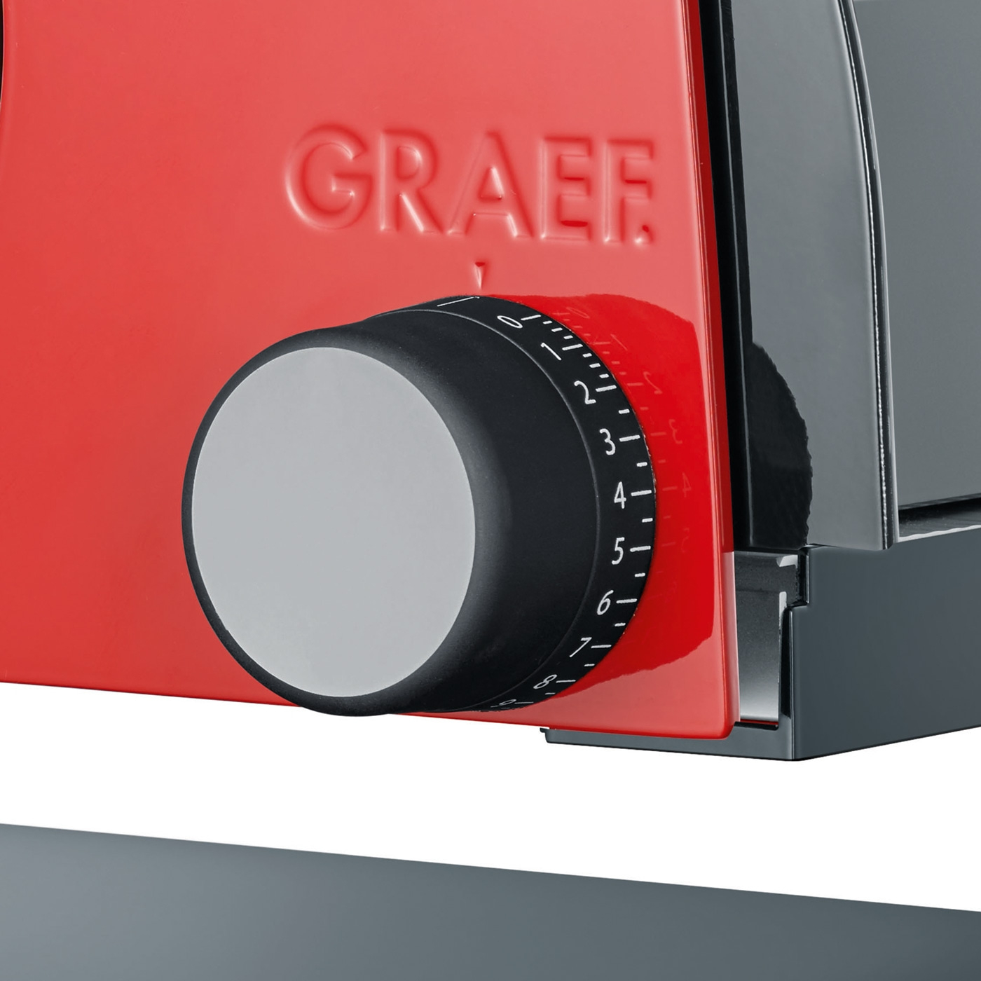 Ein roter Graef-Schneidegerät mit Einstellknopf
