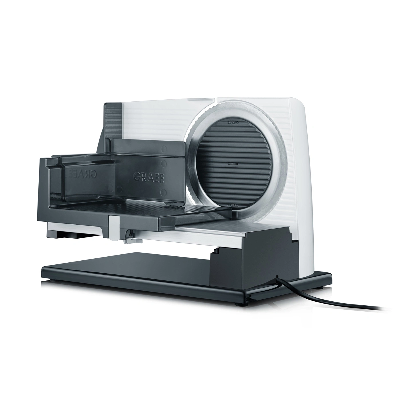 A white and black Graef slicer with a cable on a table.