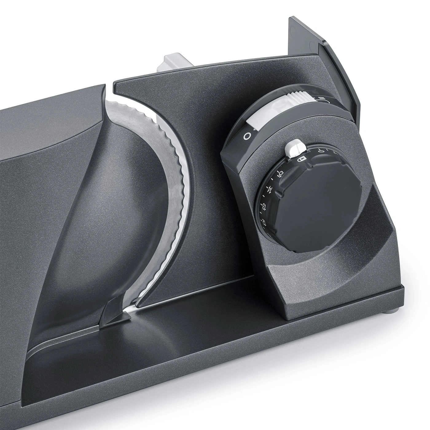 Gray electric food slicer with adjustment dial and blade for slicing food.