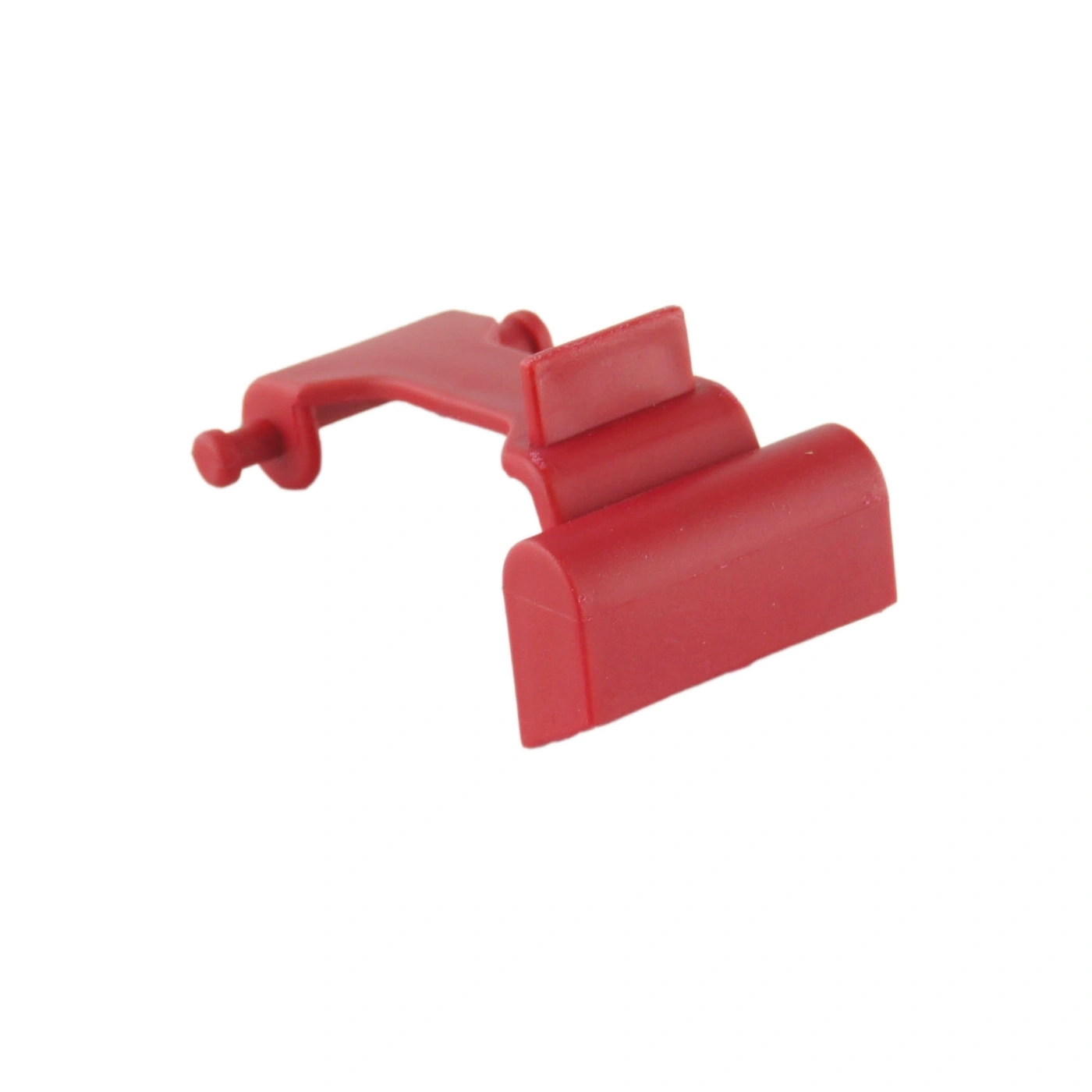 Red plastic component with an unusual shape, isolated on a white background.
