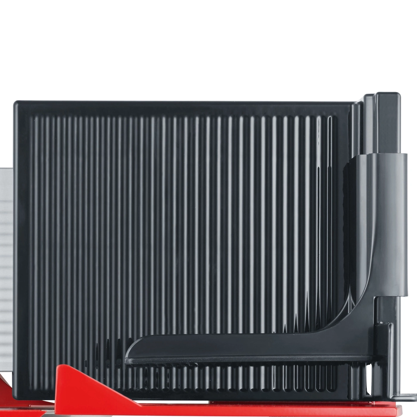 Close-up of a black cutting aid with red elements