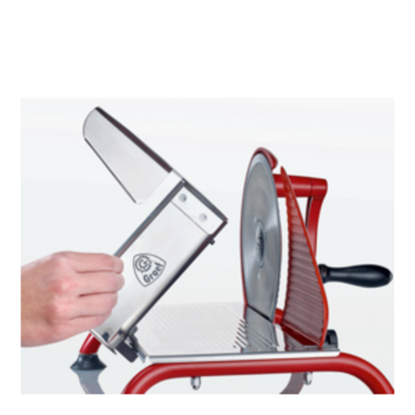 Slicing machine with red frame and silver blades, which is opened.