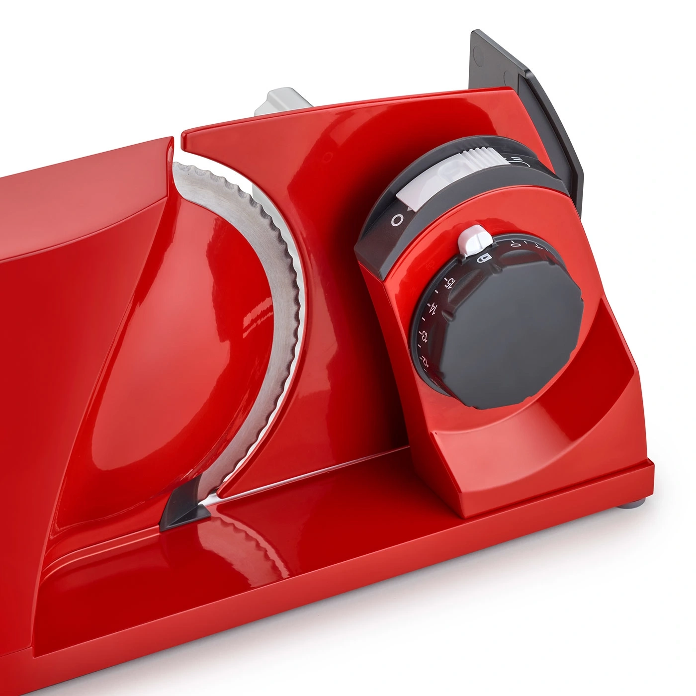 Red electric slicer with blade and thickness adjustment dial for food preparation.