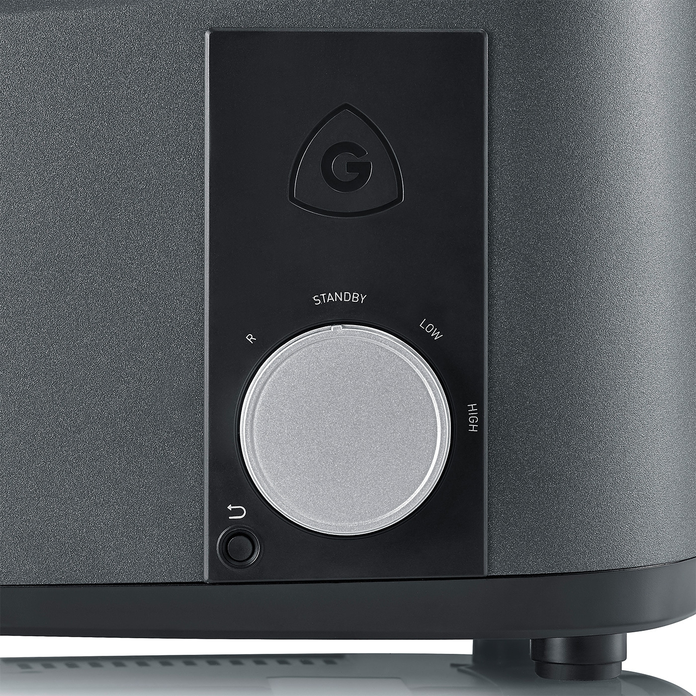 Nahaufnahme eines Geräts mit Drehknopf und Logo. Schwarz und Grau.