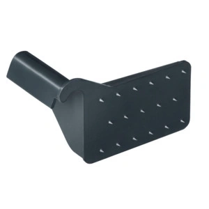 Dark grey tool with spikes, for cleaning purposes, close-up shot.