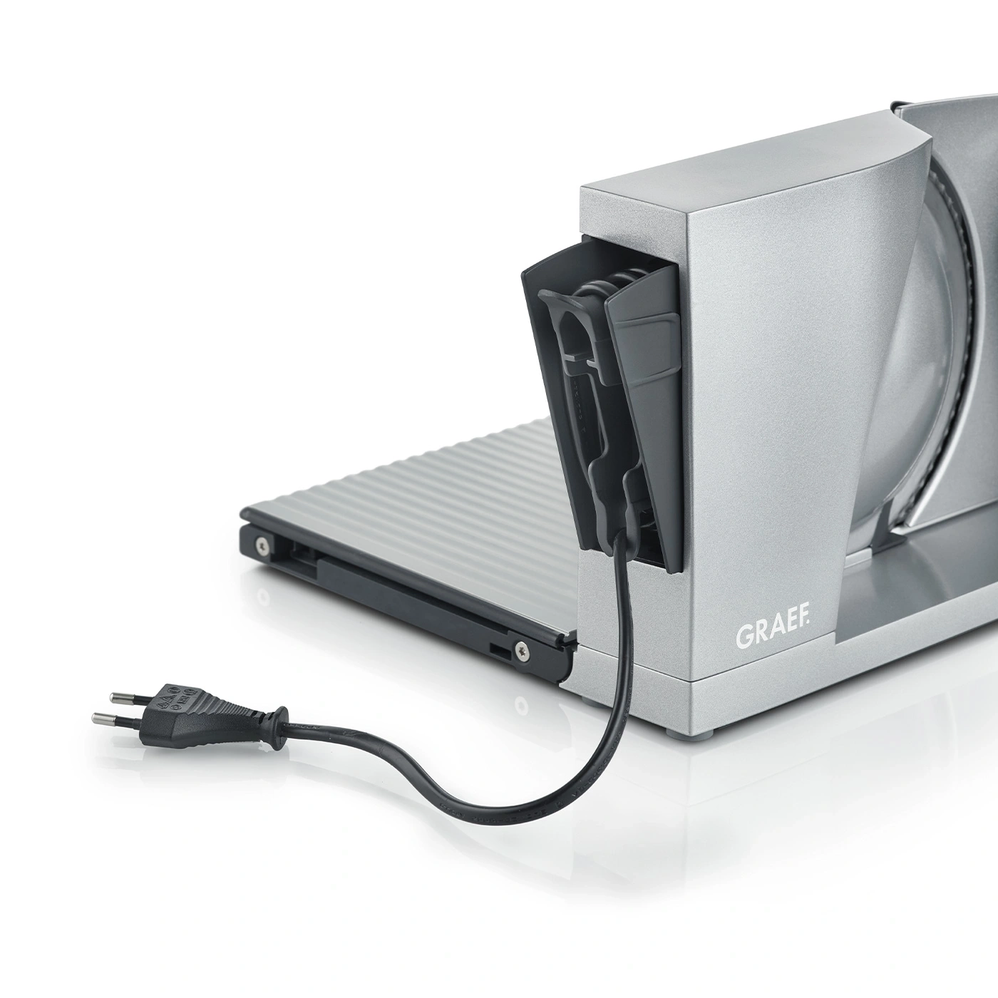 Graef slicer with power cord and plug on a white background, close-up