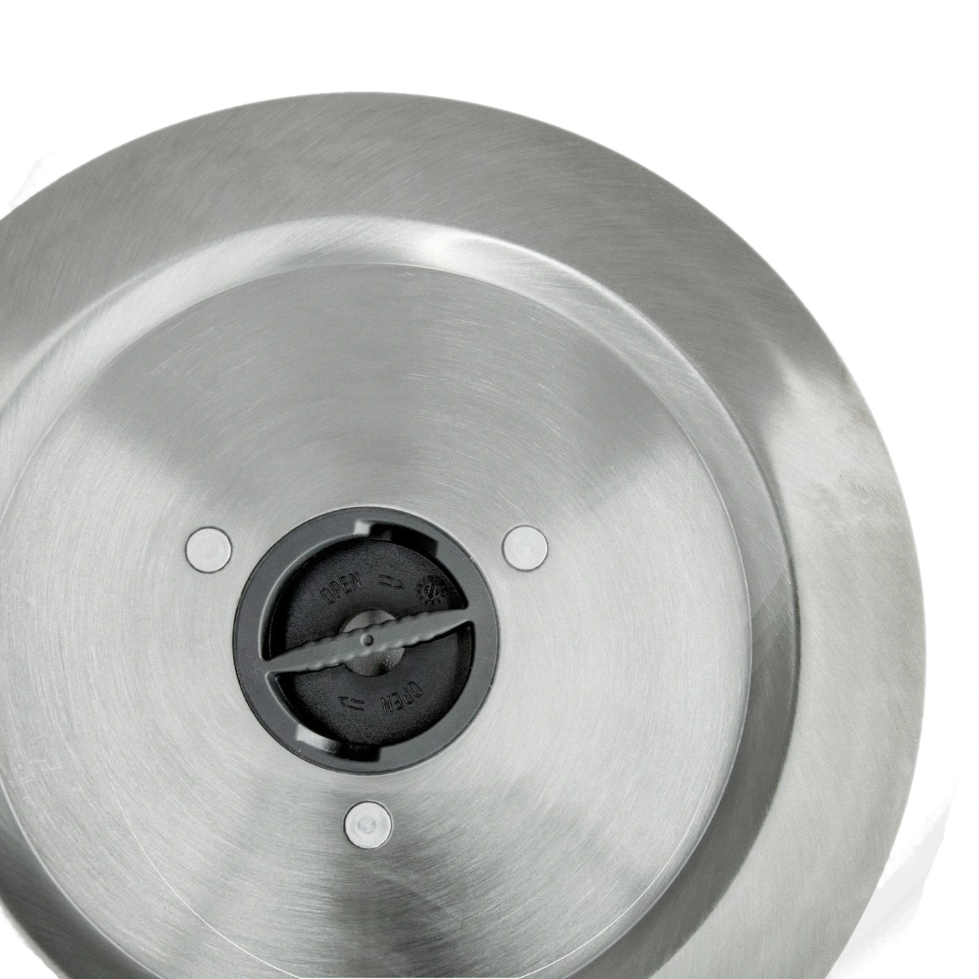 Close-up of a metallic object with "OPEN" and "CLOSE" markings on it.